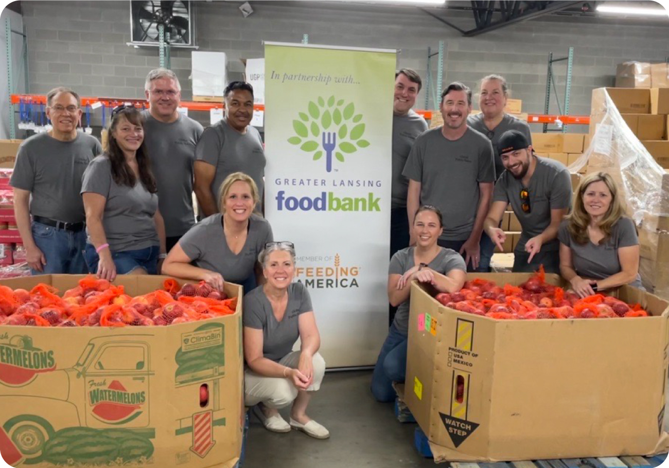 Group photo of Global Public Safety employees volunteering at food bank